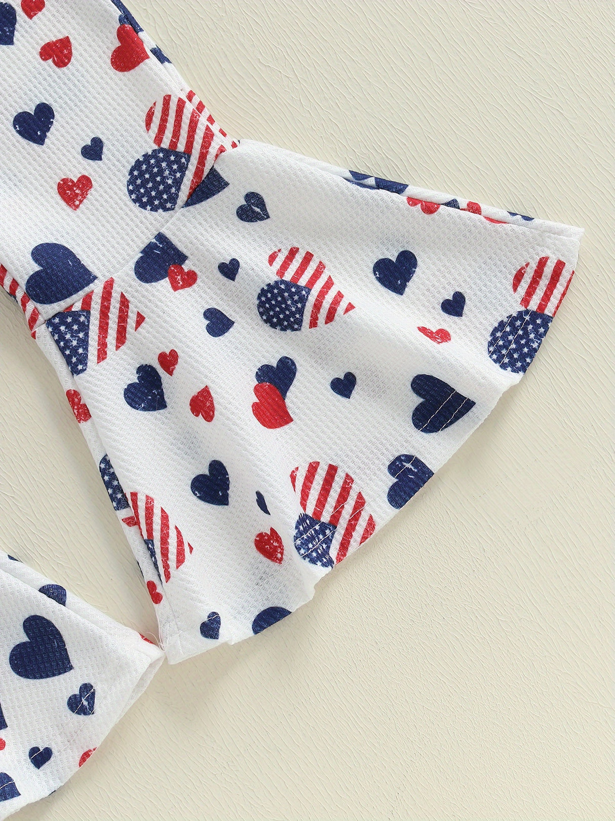 Patriotic Heart Print Flared Overalls for Little Girls – Sleeveless Suspender Pants with Twist Detail, Perfect for 4th of July & Independence Day Celebrations, Navy Blue with Red & White Hearts, Summer Casual Wear, Perfect